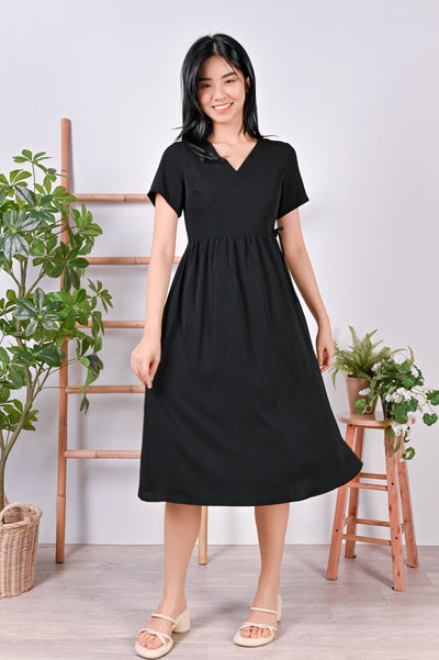 All Would Envy Dresses EILY FAUX-WRAP DRESS IN BLACK